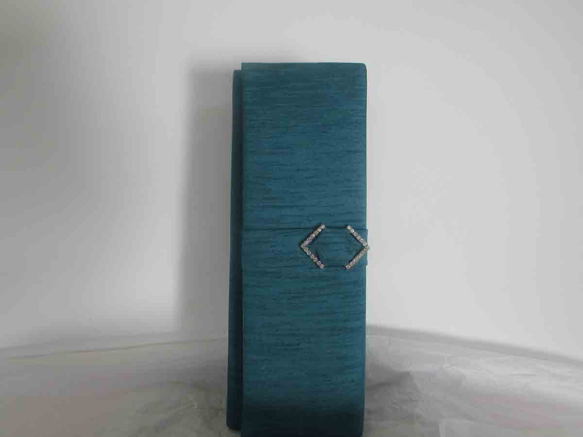 Silk clutch bag in peacock