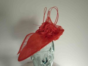 Three quarter brim hatinator with flower in coral