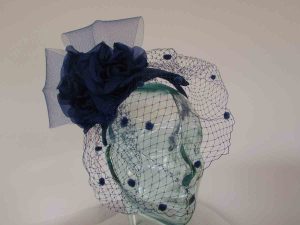 Sinamay base headband with netting veil in cobalt blue