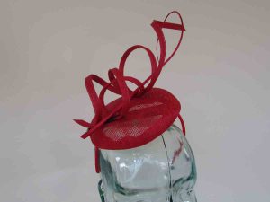 Pillbox fascinator with sinamay swirls in carmine red