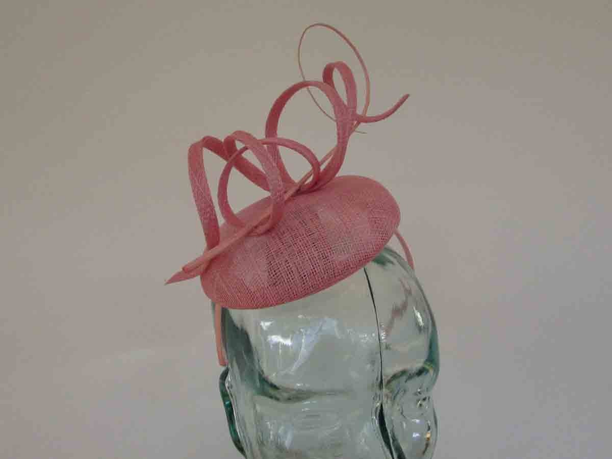 Pillbox fascinator with sinamay swirls in confetti pink
