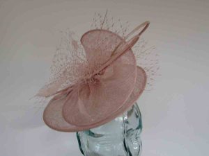 Sinamay swirl fascinator in cameo pink