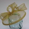 Sinamay fascinator with feathers in citrus green
