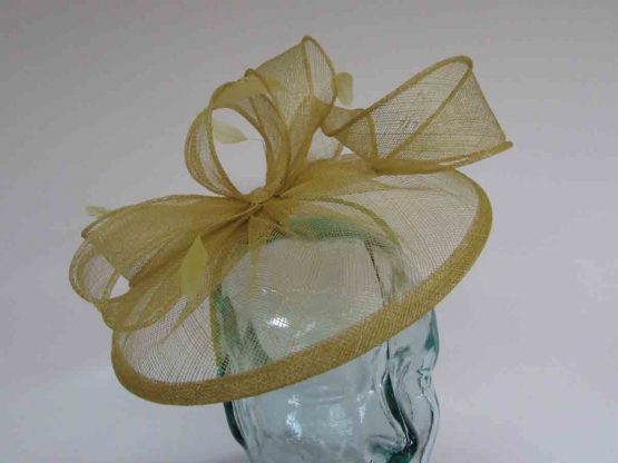 Sinamay fascinator with feathers in citrus green