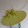 Circular hatinator with sinamay bow in citrus lime