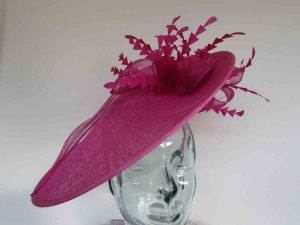 Large hatinator with diamante shaped feathers in fucshia