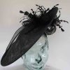 Large hatinator with diamante shaped feathers in navy