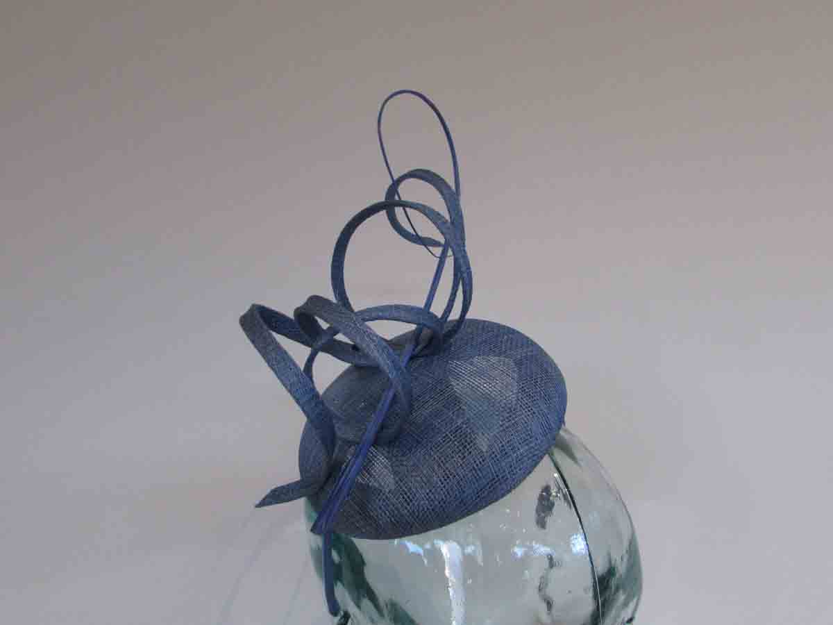Pillbox fascinator with sinamay swirls in baby blue