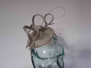 Pillbox fascinator with sinamay swirls in platinum