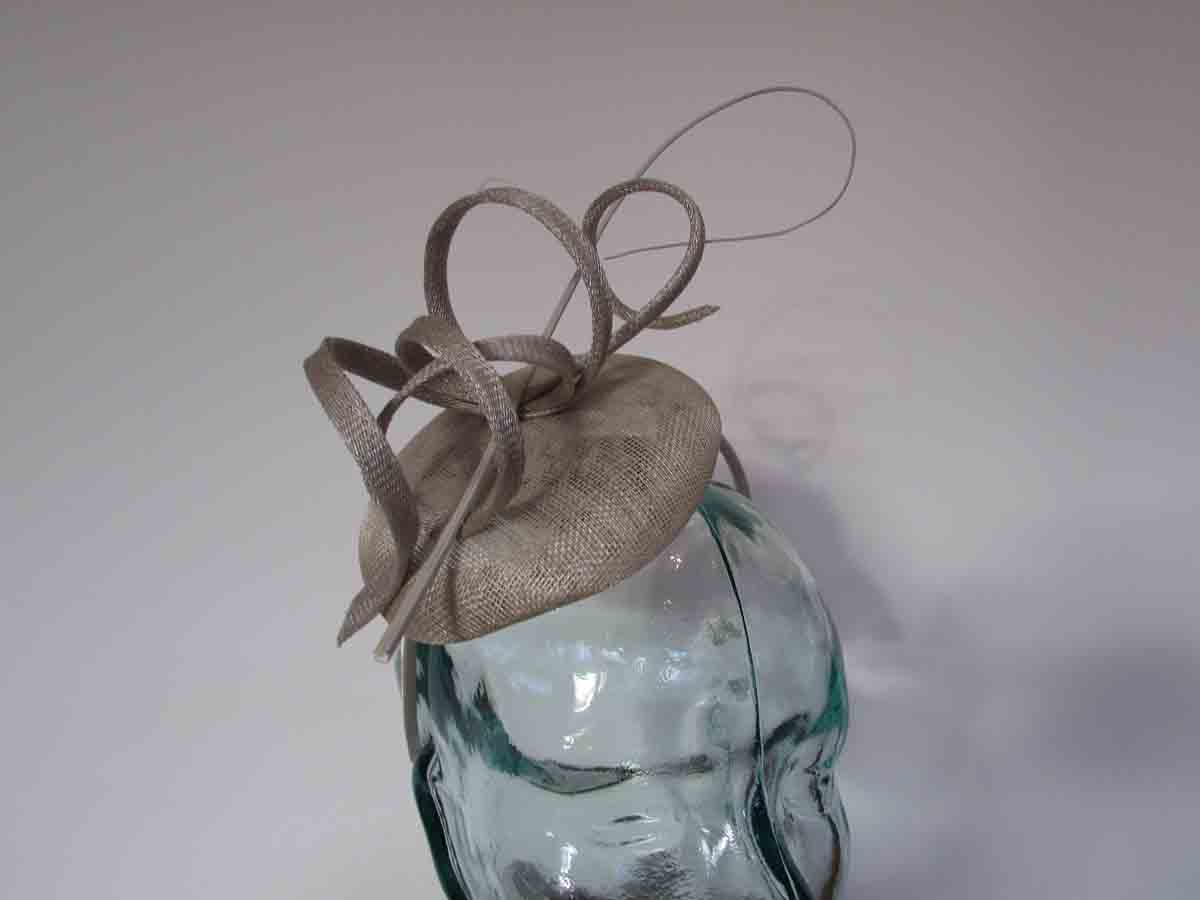 Pillbox fascinator with sinamay swirls in platinum