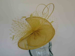 Sinamay swirl fascinator in daffodil yellow