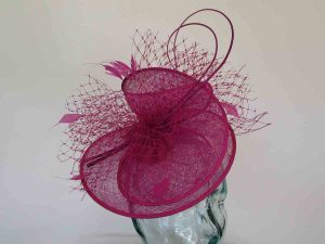 Sinamay swirl fascinator in fucshia