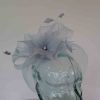 Crin fascinator with feathered flower in baby blue