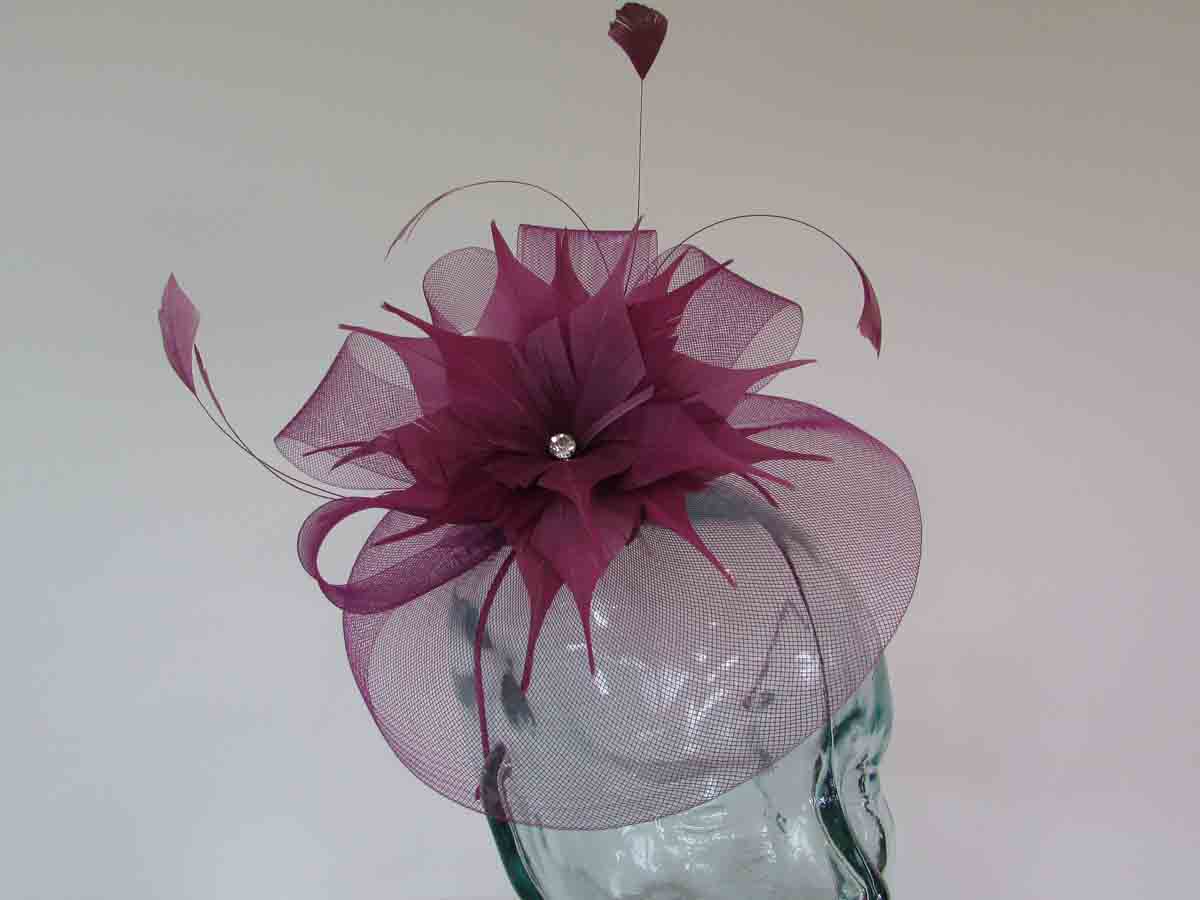 Crin fascinator with feathered flower in deep peony