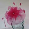 Crin fascinator with feathered flower in raspberry pink