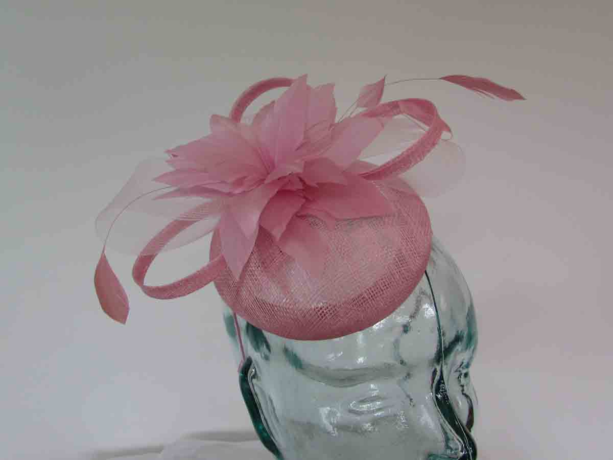 Pillbox fascinator with flower in wild rose