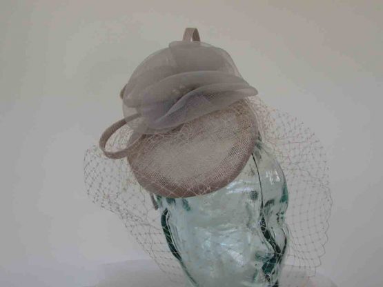 Pillbox fascinator with birdcage netting in pearl silver
