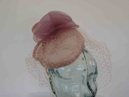 Pillbox fascinator with birdcage netting in rose pink