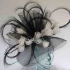 Large swirl of crin  fascinator in black with white feathered flowers