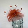 Crin fascinator with feathered flower in burnt orange