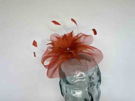 Crin fascinator with feathered flower in burnt orange