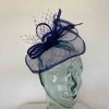 Small sinamay fascinator with netting in cobalt