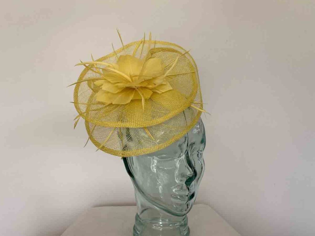 Sinamay fascinator with feahered flower in bright yellow Love Fascinators