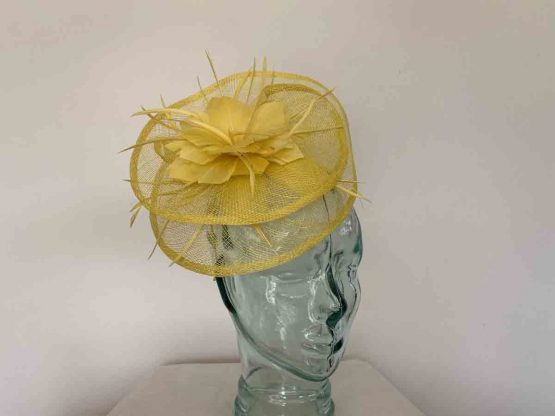 Sinamay fascinator with feahered flower in bright yellow