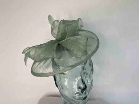Sinamay fascinator with feathers in apple green