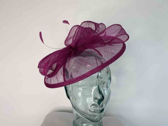 Sinamay fascinator with feathers in fuschia
