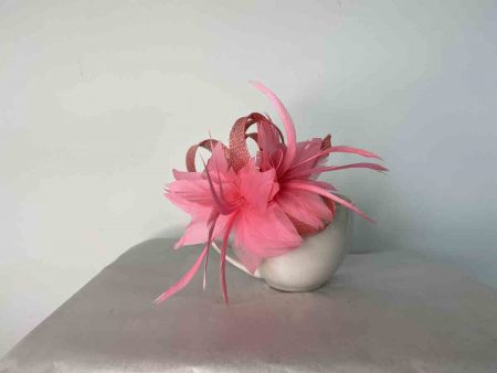 Sinamay fascinator in coral pink
