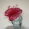 Twisted sinamay fascinator in cerise