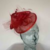 Twisted sinamay fascinator in poppy red