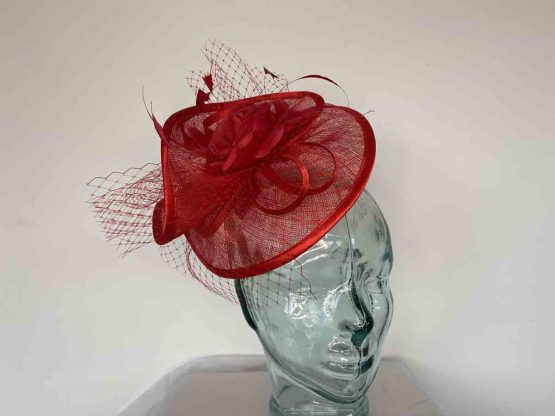 Twisted sinamay fascinator in poppy red