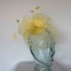 Crin fascinator with feathered flower in bright yellow