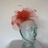 Crin fascinator with feathered flower in red