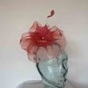 Crin fascinator with feathered flower in tangerine