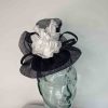 Pillbox base fascinator with flower detail in navy and white