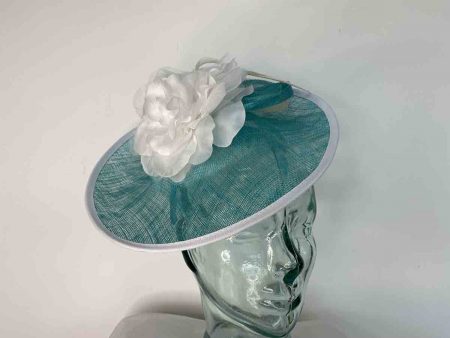 Sinamay hatinator with flower in turquoise and white