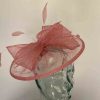 Sinamay fascinator with feathers in coral pink