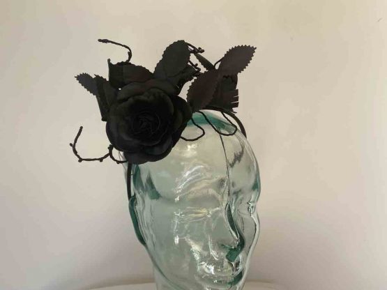 Material rose and leaf fascinator in black