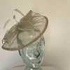 Tear drop fascinator with sinamay leaves in moss green