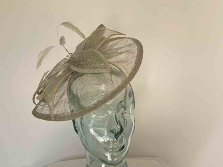 Tear drop fascinator with sinamay leaves in moss green