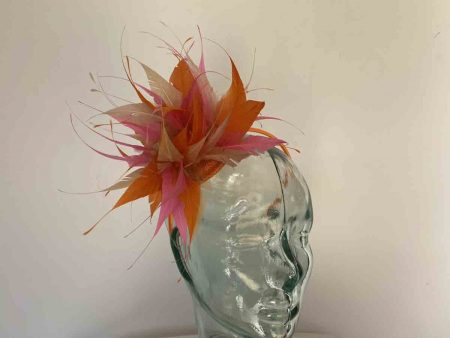 Feathered fascinator in marmalade, coral and champagne