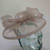 Sinamay fascinator with feathers in praline silver