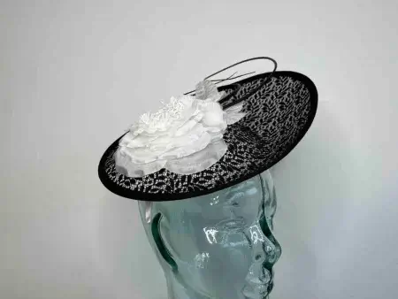 Oval hatinator with lace detail in black and white