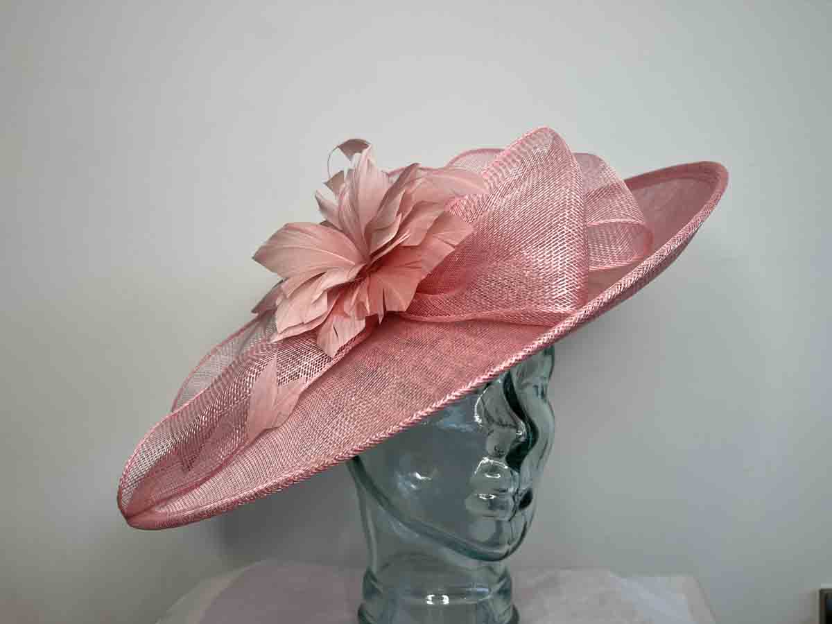 Large sinamay hatinator with feathered flower in confetti pink