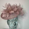 Hatinator with dramatic feather detail in crystal pink