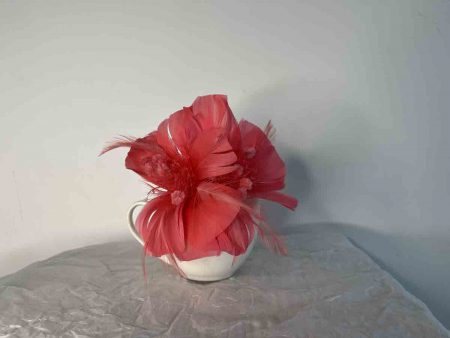 Feathered fascinator in bright coral