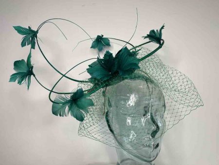 Five quill fascinator with flower detail in emerald